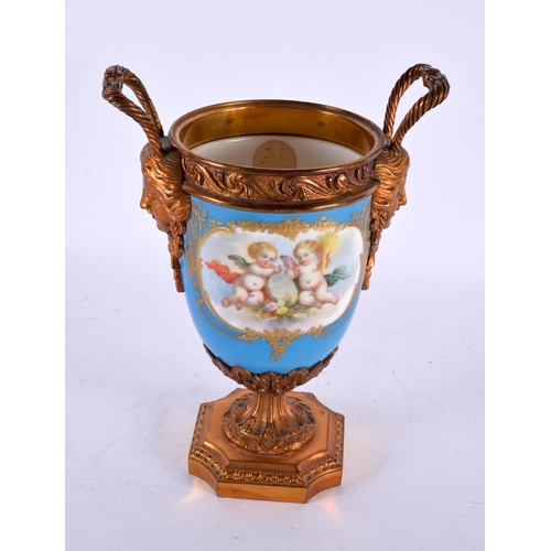 764 - A 19TH CENTURY FRENCH SEVRES PORCELAIN TWIN HANDLED VASE painted with putti. 23 cm high.