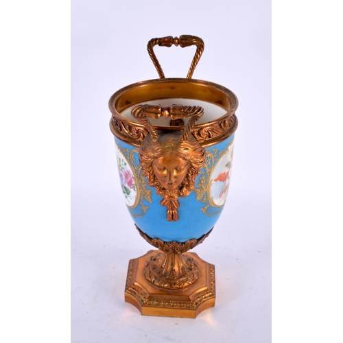 764 - A 19TH CENTURY FRENCH SEVRES PORCELAIN TWIN HANDLED VASE painted with putti. 23 cm high.