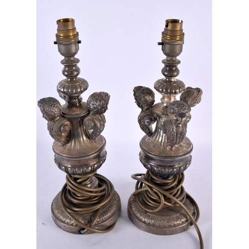 772 - A PAIR OF ANTIQUE CONTINENTAL SILVER PLATED TRIPLE CHERUB LAMPS. 34 cm high.