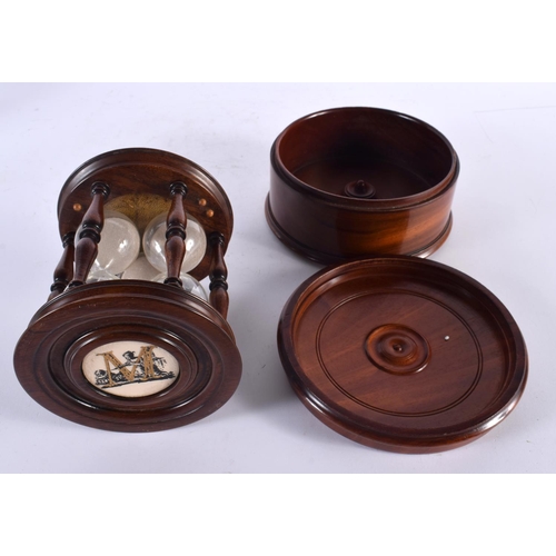 773 - AN EDWARDIAN TREEN SAND TIMER together with a similar mahogany box. Largest 16 cm diameter. (2)