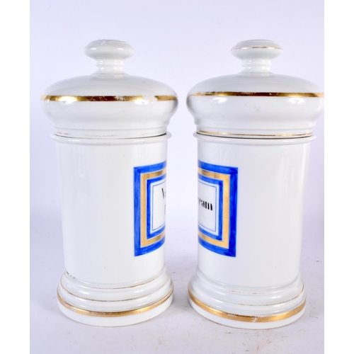 78 - A PAIR OF ANTIQUE FRENCH PORCELAIN DRUG JARS AND COVERS Vaseline & Cold Cream. 26.5 cm high.