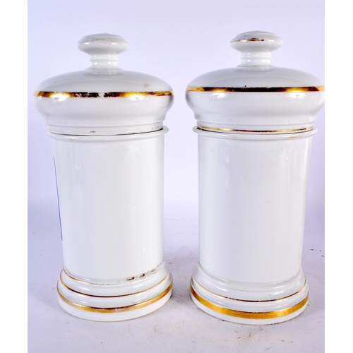 78 - A PAIR OF ANTIQUE FRENCH PORCELAIN DRUG JARS AND COVERS Vaseline & Cold Cream. 26.5 cm high.