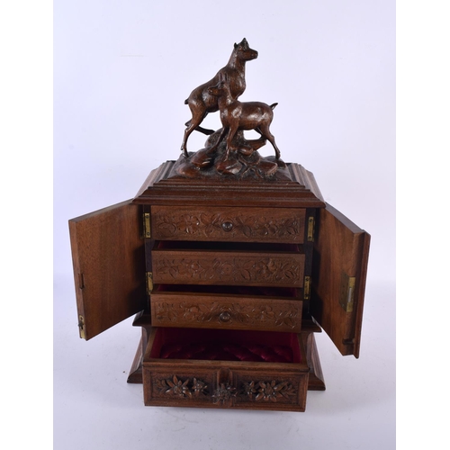 786 - A LARGE 19TH CENTURY BAVARIAN BLACK FOREST CARVED WOOD JEWELLERY CABINET formed with two ibex. 40 cm... 