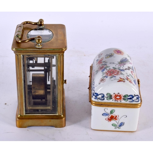 802 - A BRASS CARRIAGE CLOCK together with a French porcelain casket. Largest 15cm high inc handle. (2)