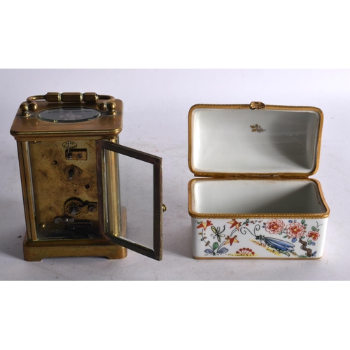 802 - A BRASS CARRIAGE CLOCK together with a French porcelain casket. Largest 15cm high inc handle. (2)