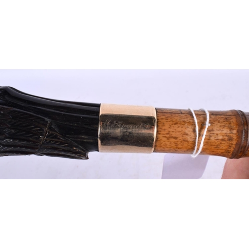 818 - A CARVED HORN PARROT HEAD WALKING CANE. 90cm long.