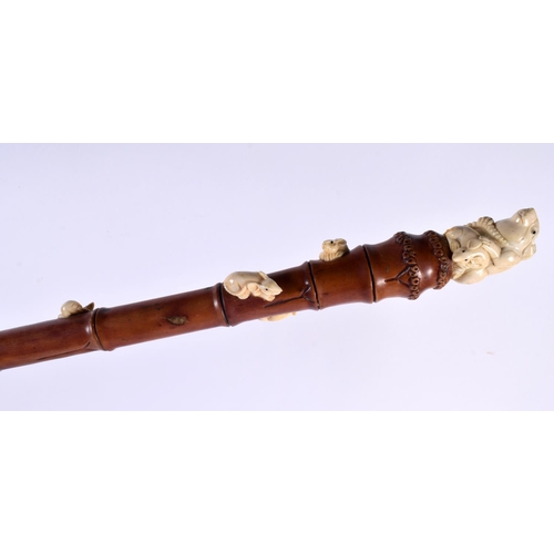 825 - A JAPANESE CARVED WOOD BONE AND WOOD RAT WALKING CANE. 90cm long.