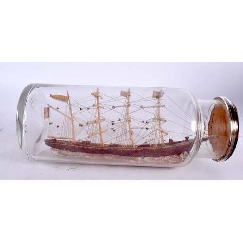 83 - AN ANTIQUE SHIP IN A BOTTLE. 22.5 cm high.