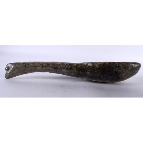 843 - A TRIBAL CARVED STONE PESTLE together with two natural crystal pestles. Largest 27 cm long. (3)