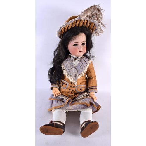 854 - A FINE SIMON HALBIG BISQUE HEADED PORCELAIN DOLL wearing original mustard clothing. 65 cm long.