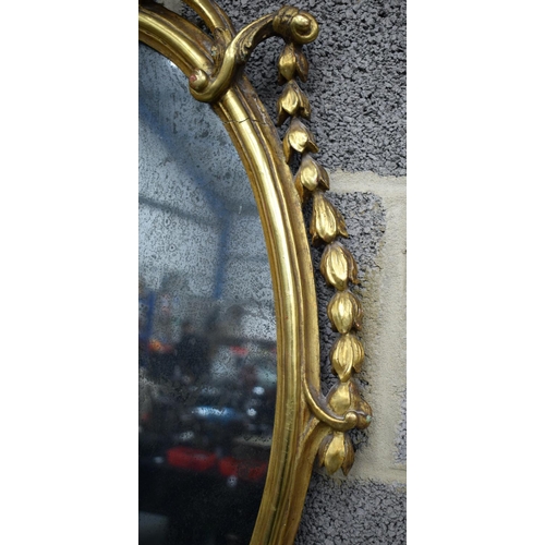 856 - A GILTWOOD HANGING MIRROR. 80 cm x 50 cm.