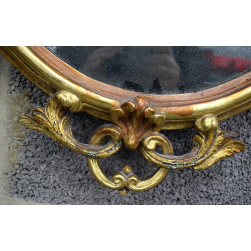 856 - A GILTWOOD HANGING MIRROR. 80 cm x 50 cm.