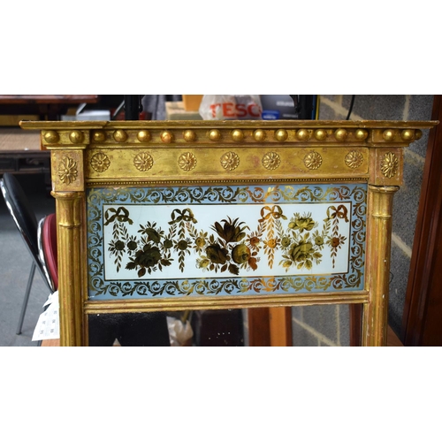 857 - A LARGE ANTIQUE GILTWOOD AND REVERSE PAINTED GLASS MIRROR. 130 cm x 65 cm.