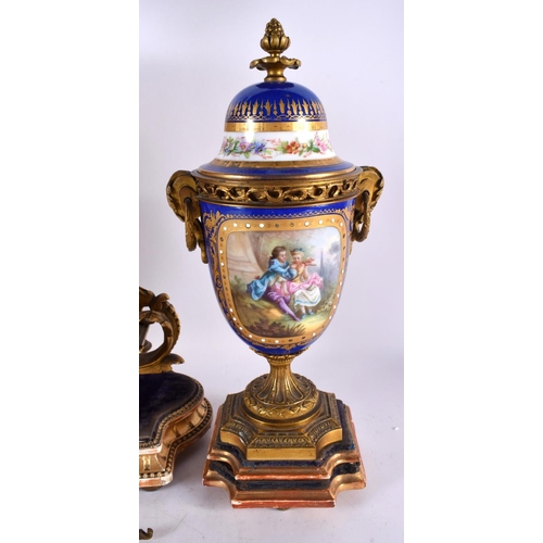 863 - A LARGE 19TH CENTURY FRENCH SEVRES PORCELAIN CLOCK GARNITURE painted with figures within landscapes ... 