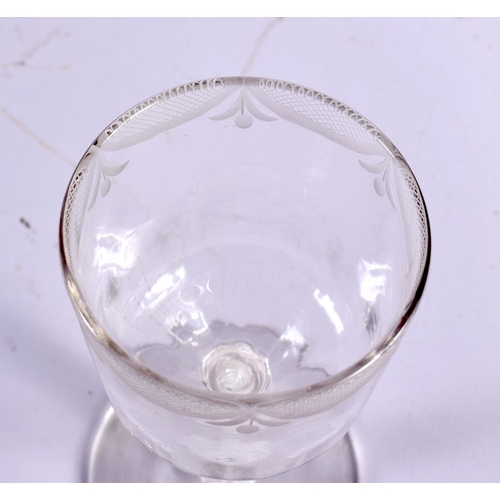 867 - AN ANTIQUE WINE GLASS. 15.5 cm high.