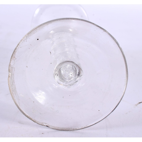 872 - AN ANTIQUE WINE GLASS. 15.5 cm high.