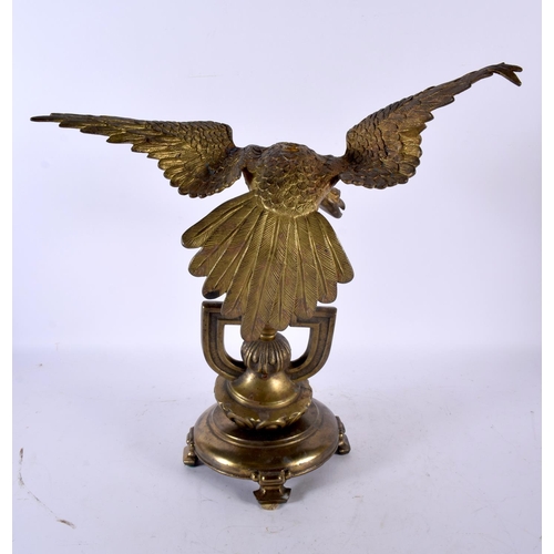 875 - AN ANTIQUE BRONZE EAGLE possibly a watch holder. 36 cm x 22cm.