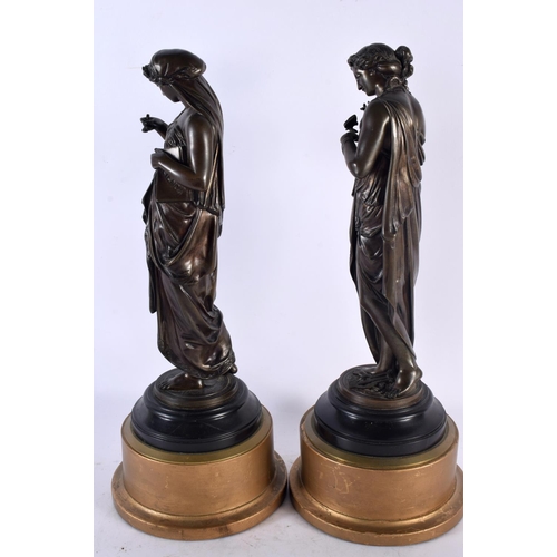 876 - A LARGE PAIR OF 19TH CENTURY CLASSICAL BRONZE FIGURES modelled upon giltwood bases. 40 cm high.