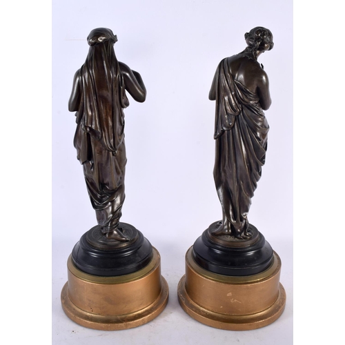 876 - A LARGE PAIR OF 19TH CENTURY CLASSICAL BRONZE FIGURES modelled upon giltwood bases. 40 cm high.