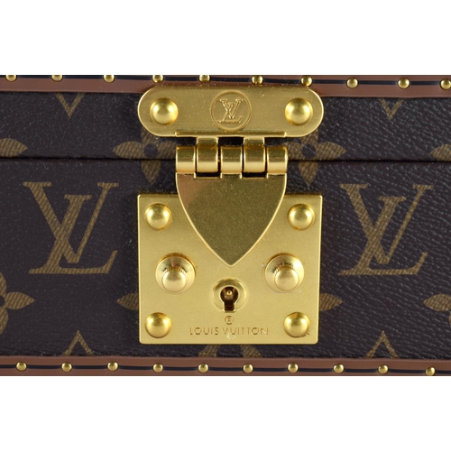 877 - A LOUIS VUITTON LEATHER WATCH BOX. 34 cm x 18cm x 12 cm.