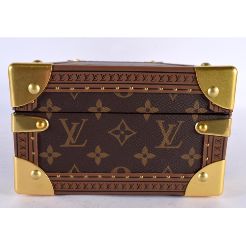 877 - A LOUIS VUITTON LEATHER WATCH BOX. 34 cm x 18cm x 12 cm.