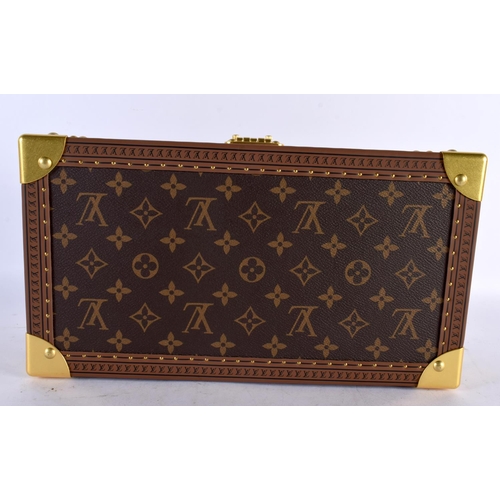 877 - A LOUIS VUITTON LEATHER WATCH BOX. 34 cm x 18cm x 12 cm.