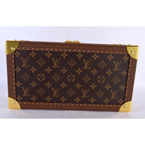 877 - A LOUIS VUITTON LEATHER WATCH BOX. 34 cm x 18cm x 12 cm.