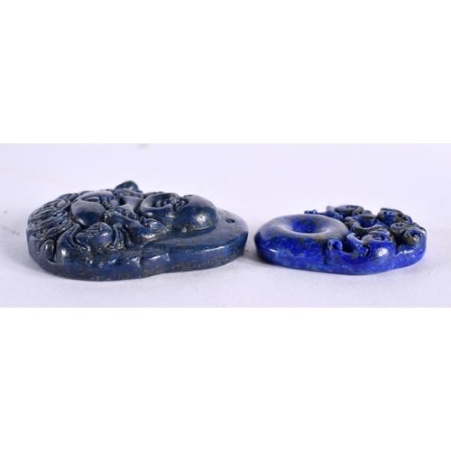 885 - TWO CHINESE CARVED LAPIS LAZULI PENDANTS 20th Century. 34.4 grams. largest 4.25 cm x 3.75 cm. (2)