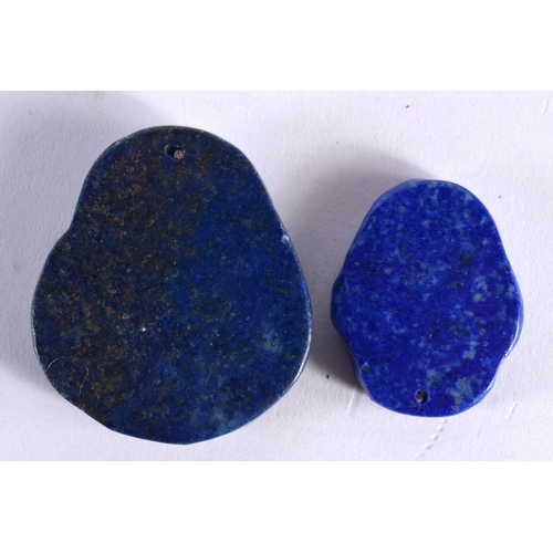 885 - TWO CHINESE CARVED LAPIS LAZULI PENDANTS 20th Century. 34.4 grams. largest 4.25 cm x 3.75 cm. (2)