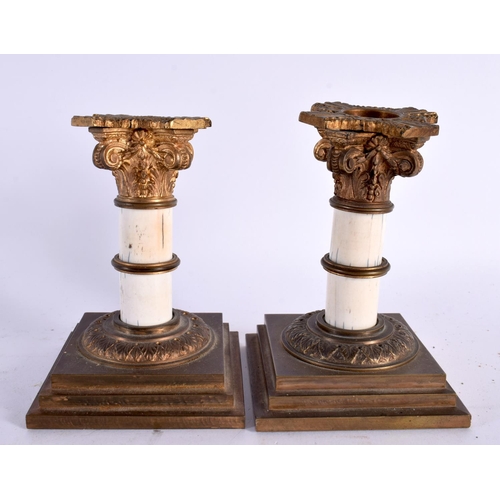 892 - A SMALL PAIR OF EARLY VICTORIAN COUNTRY HOUSE DWARF CANDLESTICKS. 11cm x 5 cm.