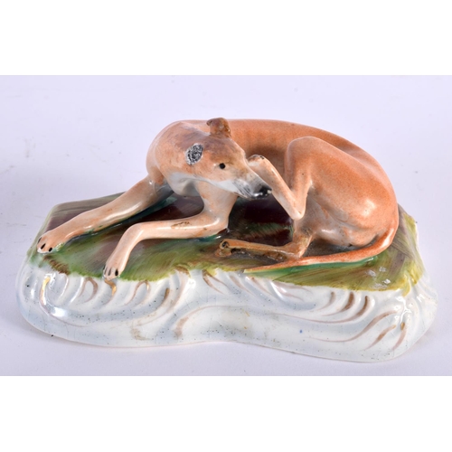 9 - TWO 19TH CENTURY STAFFORDSHIRE PORCELAIN GREYHOUNDS together with a similar model of two poodles. La... 