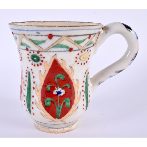 90 - A TURKISH OTTOMAN KUTAHYA POTTERY MUG. 10 cm high.