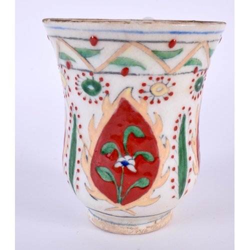 90 - A TURKISH OTTOMAN KUTAHYA POTTERY MUG. 10 cm high.