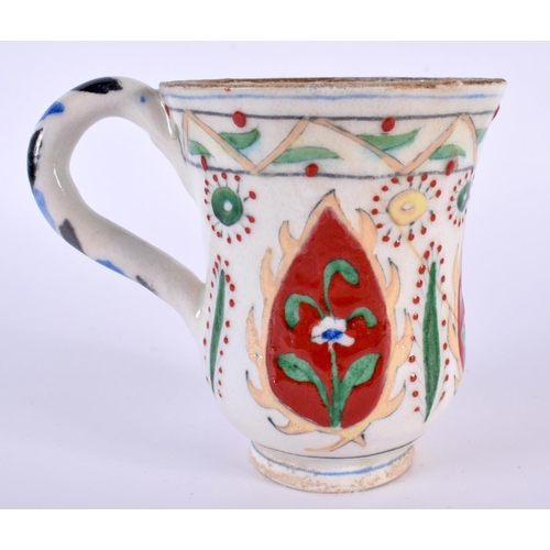 90 - A TURKISH OTTOMAN KUTAHYA POTTERY MUG. 10 cm high.