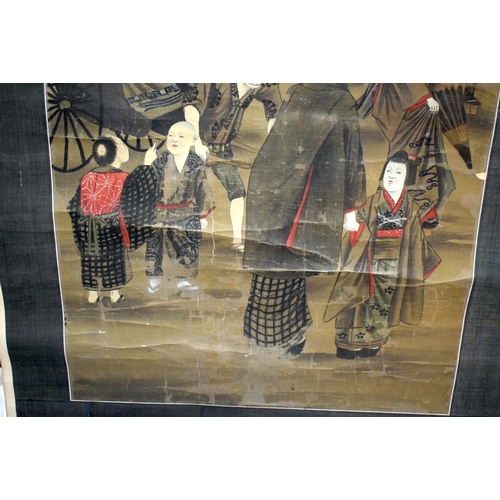 902 - A 19TH CENTURY JAPANESE MEIJI PERIOD SILK PAINTED SCROLL depicting figures and a devil within a land... 