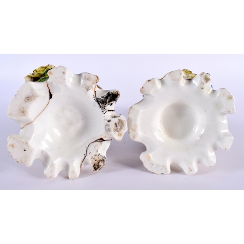 94 - A PAIR OF EARLY 19TH CENTURY ENGLISH PORCELAIN SCENT BOTTLES AND STOPPERS modelled encrusted with fl... 