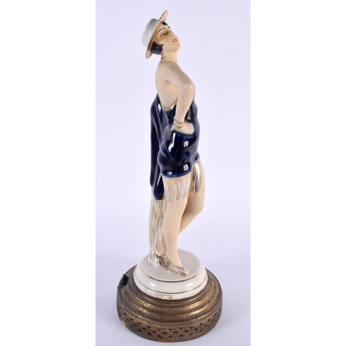 98 - A VINTAGE EUROPEAN PORCELAIN FIGURE OF A FEMALE. 30cm high.