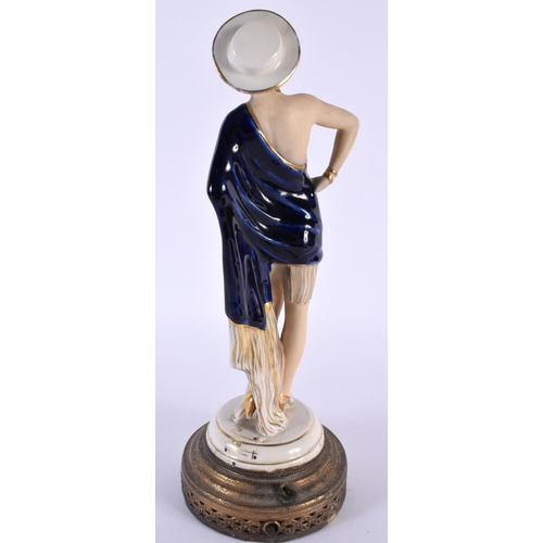 98 - A VINTAGE EUROPEAN PORCELAIN FIGURE OF A FEMALE. 30cm high.