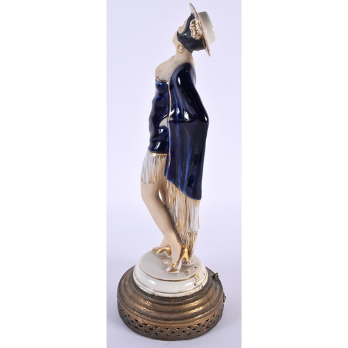 98 - A VINTAGE EUROPEAN PORCELAIN FIGURE OF A FEMALE. 30cm high.