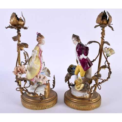 99 - A PAIR OF ANTIQUE CONTINENTAL PORCELAIN FIGURAL LAMPS with gilt metal mounts. 23 cm high.