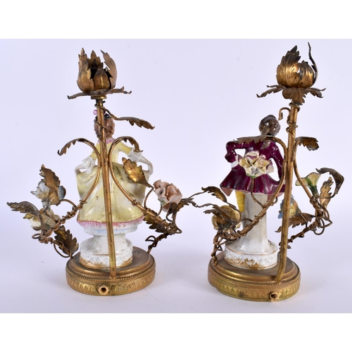 99 - A PAIR OF ANTIQUE CONTINENTAL PORCELAIN FIGURAL LAMPS with gilt metal mounts. 23 cm high.