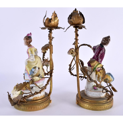 99 - A PAIR OF ANTIQUE CONTINENTAL PORCELAIN FIGURAL LAMPS with gilt metal mounts. 23 cm high.