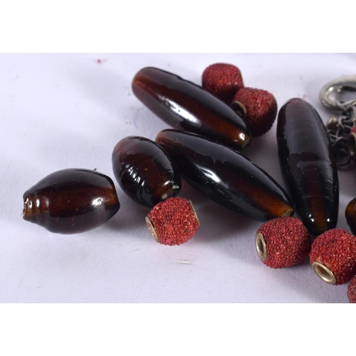 1001 - ASSORTED BEADS together with a watch strap etc. Largest 5.5 cm x 4.25 cm. (qty)