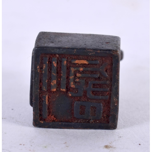 1002 - A CHINESE BRONZE BUDDHISTIC BEAST SEAL. 45 grams. 3.5 cm x 2 cm.