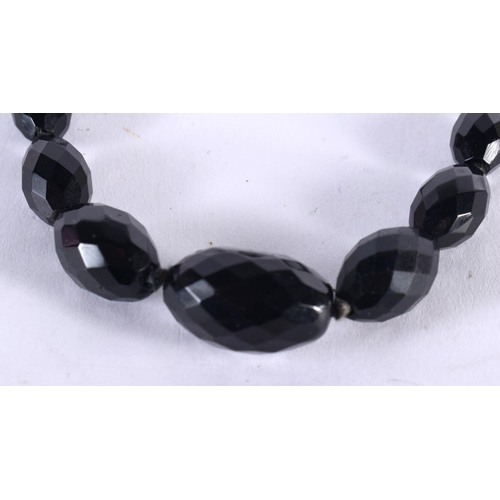 1004 - A FACETED BEAD NECKLACE. 34.8 grams. 46 cm long.