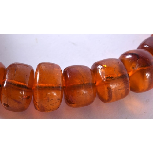 1008 - AN AMBER NECKLACE. 134 grams. 48 cm long.