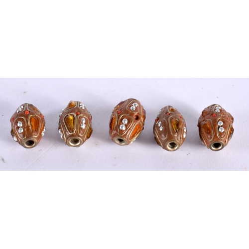 1013 - FIVE UNUSUAL PEARL CORAL NUT AND AMBER BEADS possibly Ottoman. 18.6 grams. 2 cm x 1.25 cm. (5)