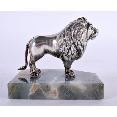 1016 - AN UNUSUAL EDWARDIAN SILVER MOSS AGATE AND RUBY FIGURE OF A LION by Henry Williamson. Birmingham 190... 