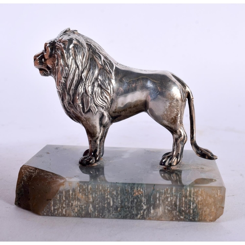 1016 - AN UNUSUAL EDWARDIAN SILVER MOSS AGATE AND RUBY FIGURE OF A LION by Henry Williamson. Birmingham 190... 