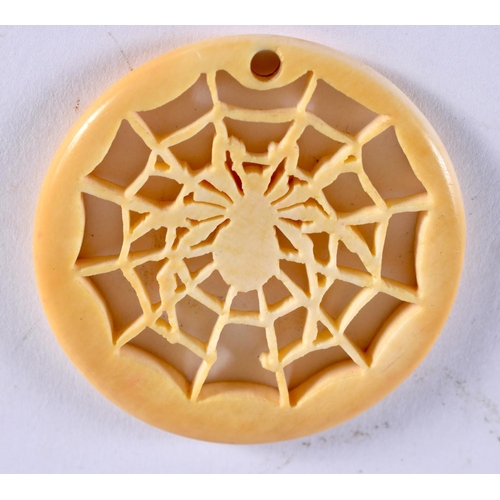 1023 - AN ANTIQUE CARVED BONE SPIDER WEB PENDANT. 5 grams. 4.25 cm diameter.